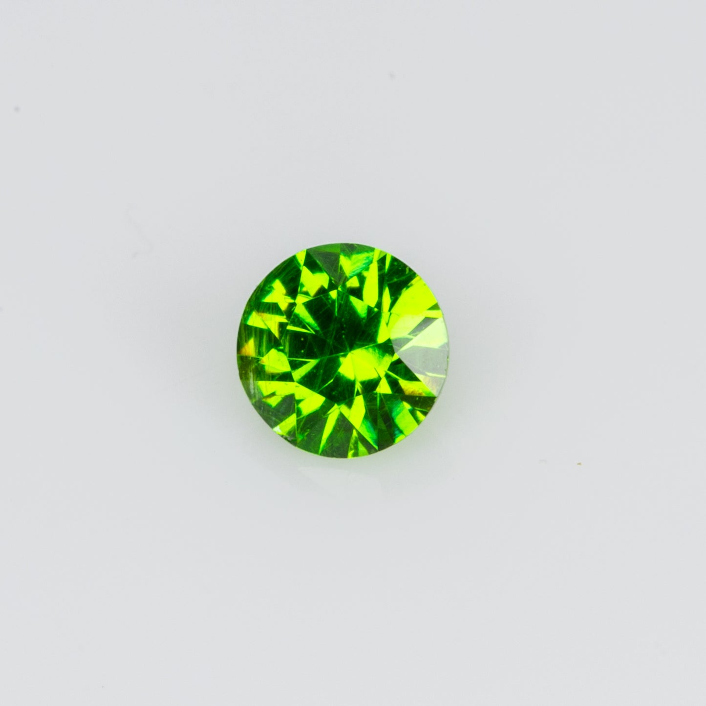 0.10 ct, Tiny vivid green faceted Russian demantoid garnet