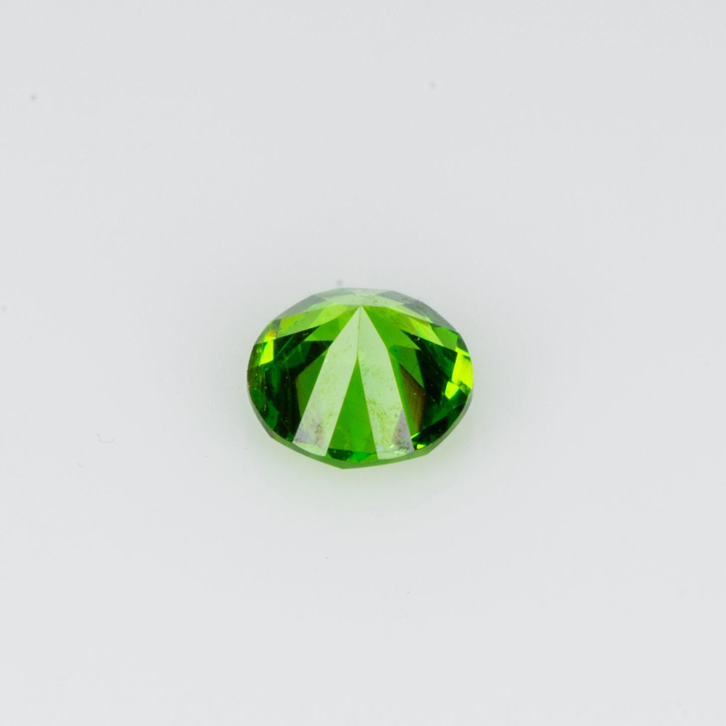 0.10 ct, Tiny vivid green faceted Russian demantoid garnet