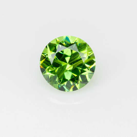 0.29 ct, Faceted Russian demantoid garnet with bissolite inclusions