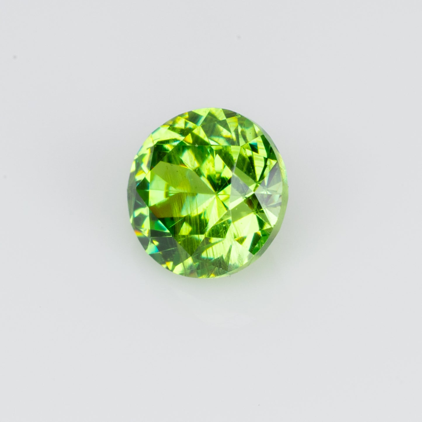 0.29 ct, Faceted Russian demantoid garnet with bissolite inclusions