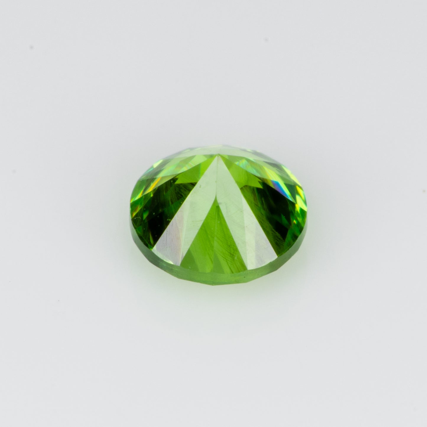 0.29 ct, Faceted Russian demantoid garnet with bissolite inclusions