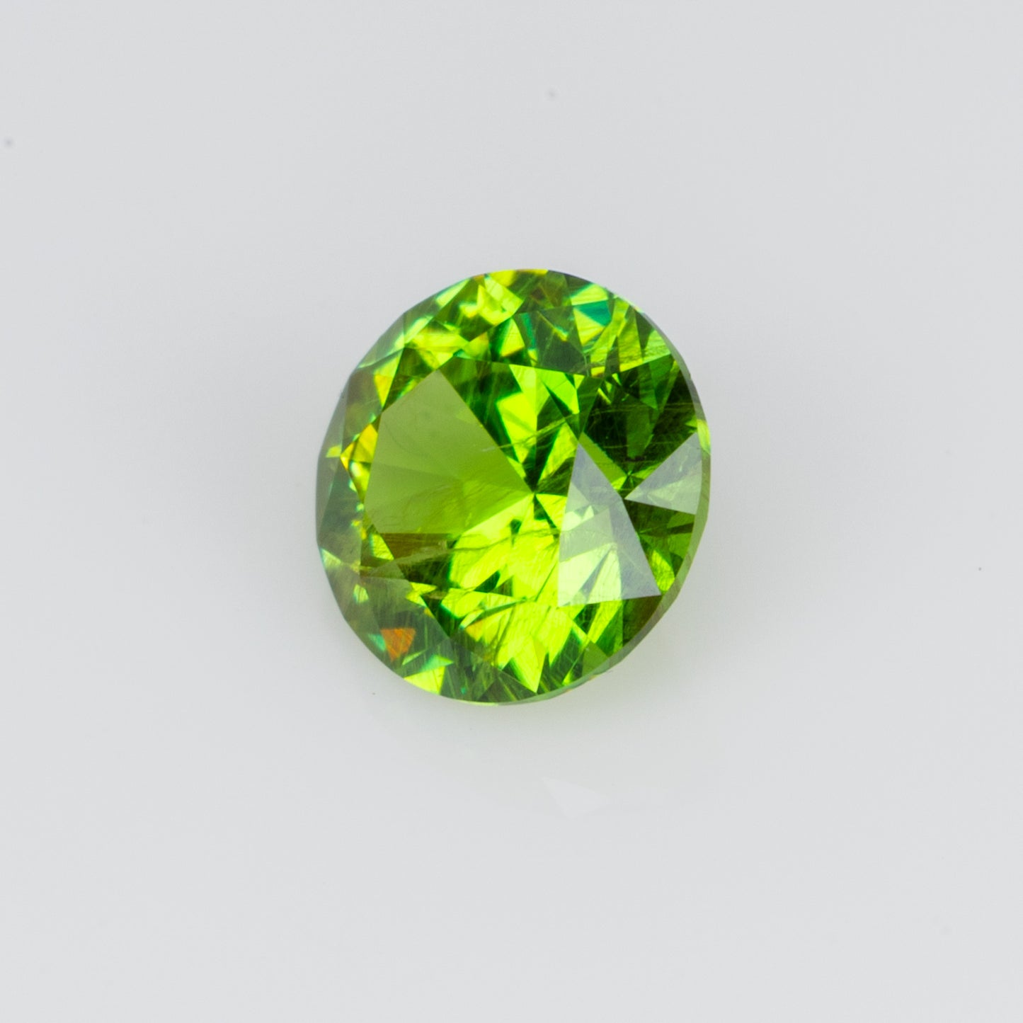 0.30 ct, Faceted Russian demantoid garnet with bissolite inclusions