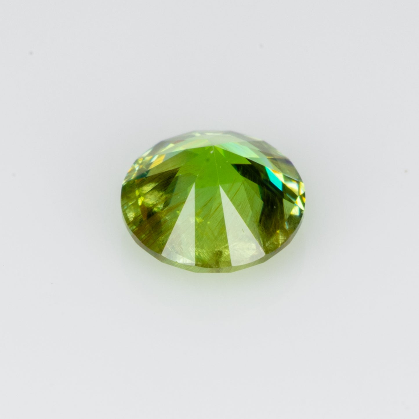 0.30 ct, Faceted Russian demantoid garnet with bissolite inclusions