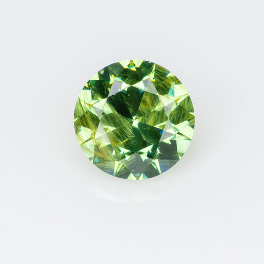 0.34 ct, Faceted Russian demantoid garnet with bissolite inclusions