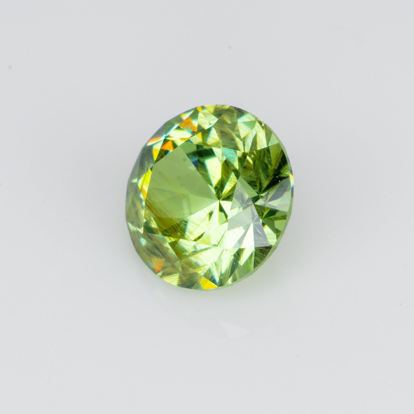 0.34 ct, Faceted Russian demantoid garnet with bissolite inclusions
