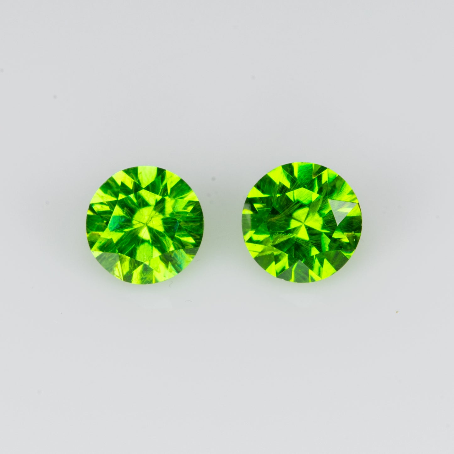 0.27 ct, Faceted vivid green russian demantoid pair