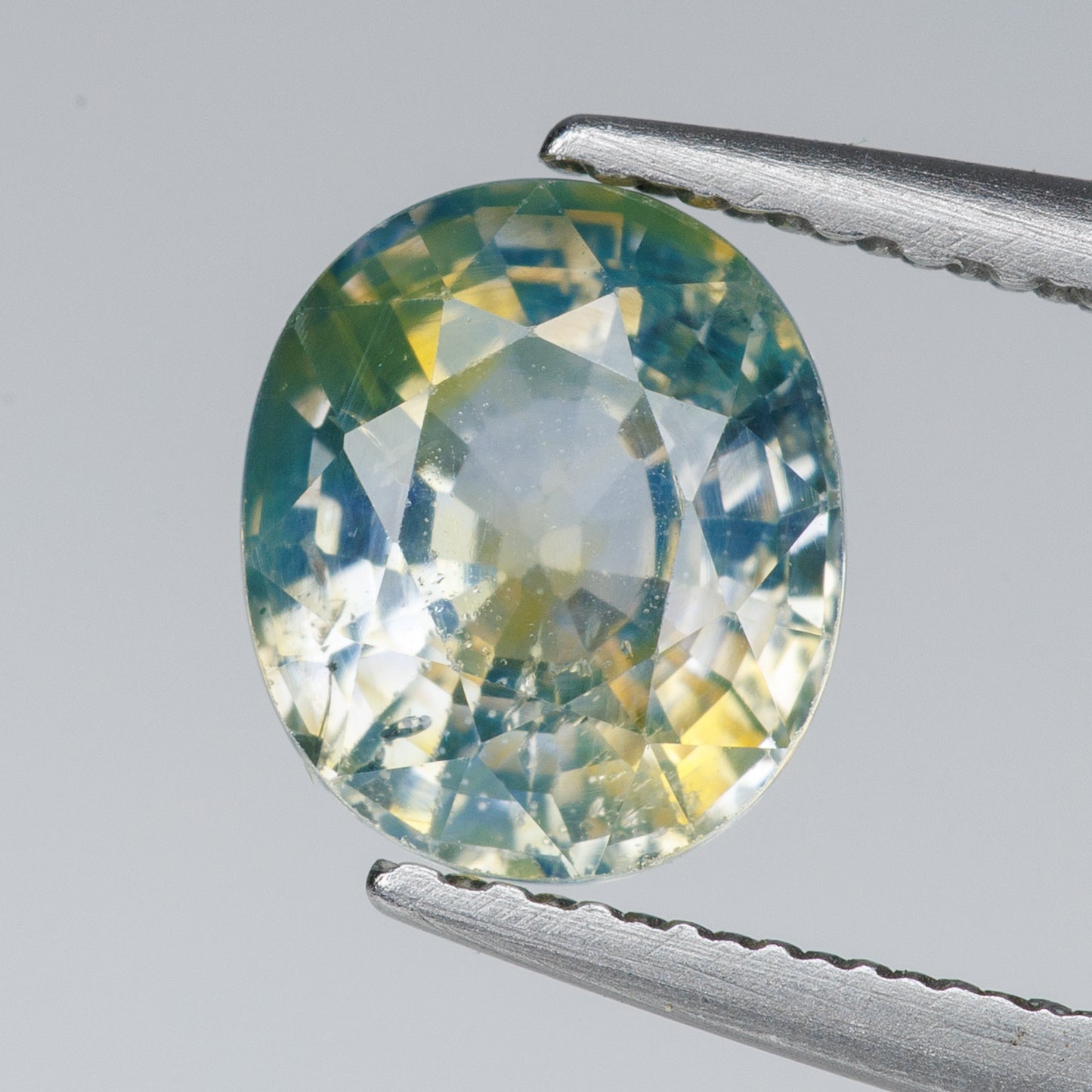 1.22 ct, Faceted parti-colored sapphire