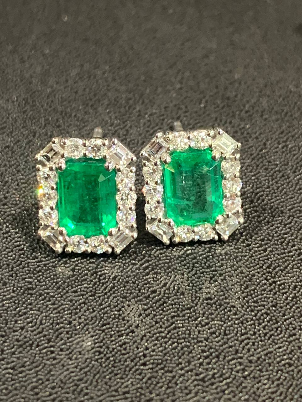 Gold earrings with faceted emeralds and diamonds