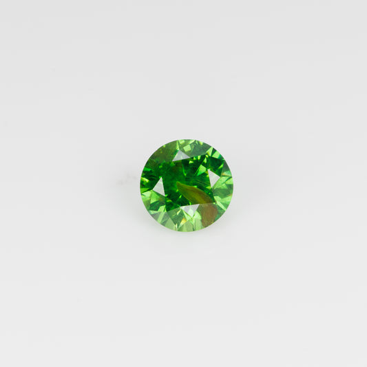 0.67 ct, Vivid green faceted Russian demantoid with byssolite inclusioms