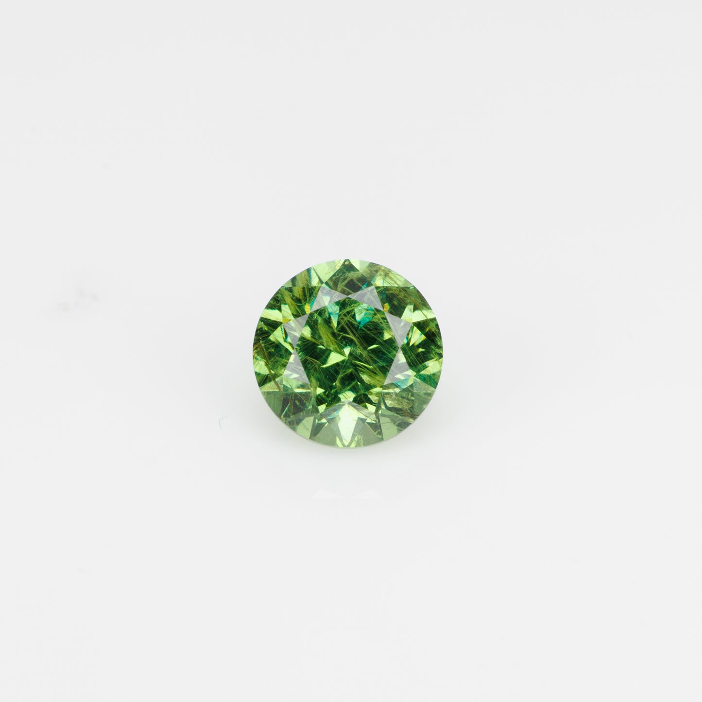 0.57 ct, Faceted Russian demantoid garnet