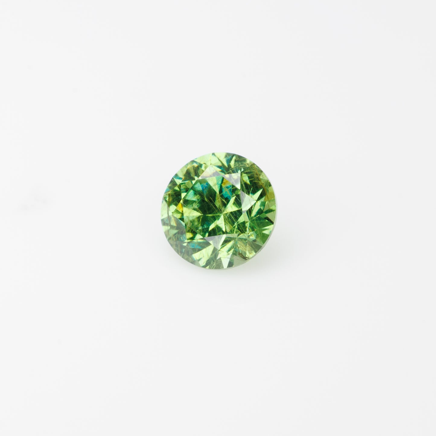 0.57 ct, Faceted Russian demantoid garnet