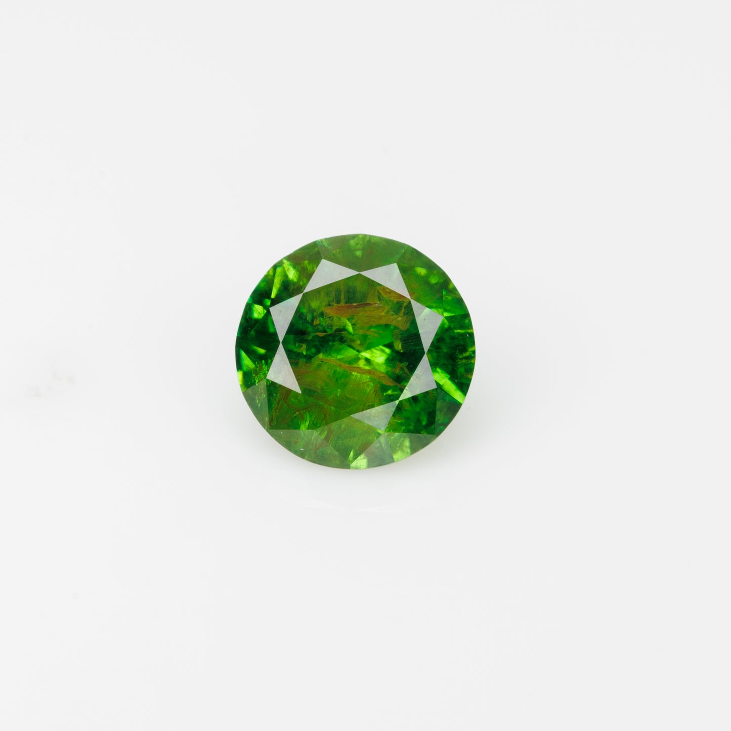 0.58 ct, Faceted Russian demantoid garnet