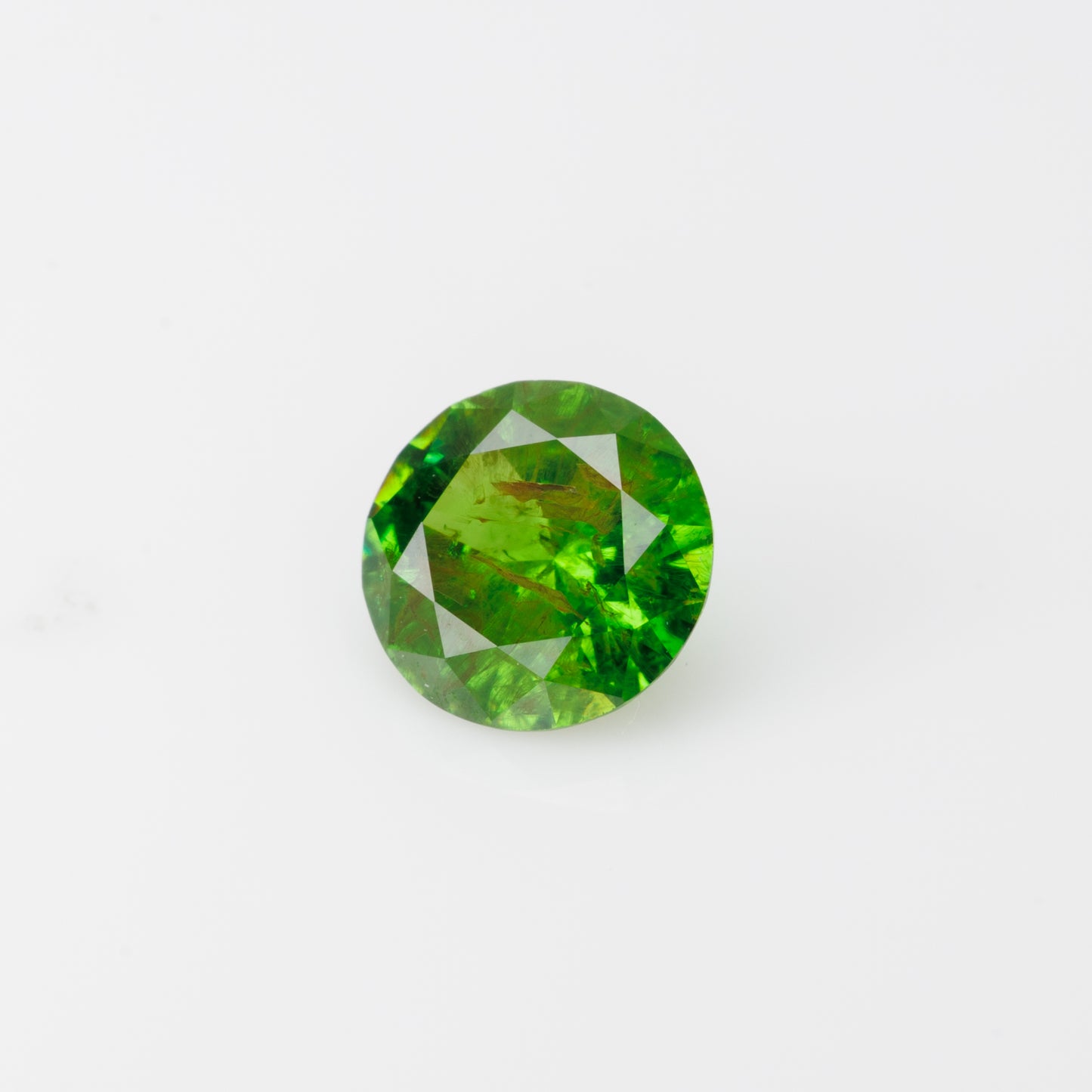 0.58 ct, Faceted Russian demantoid garnet