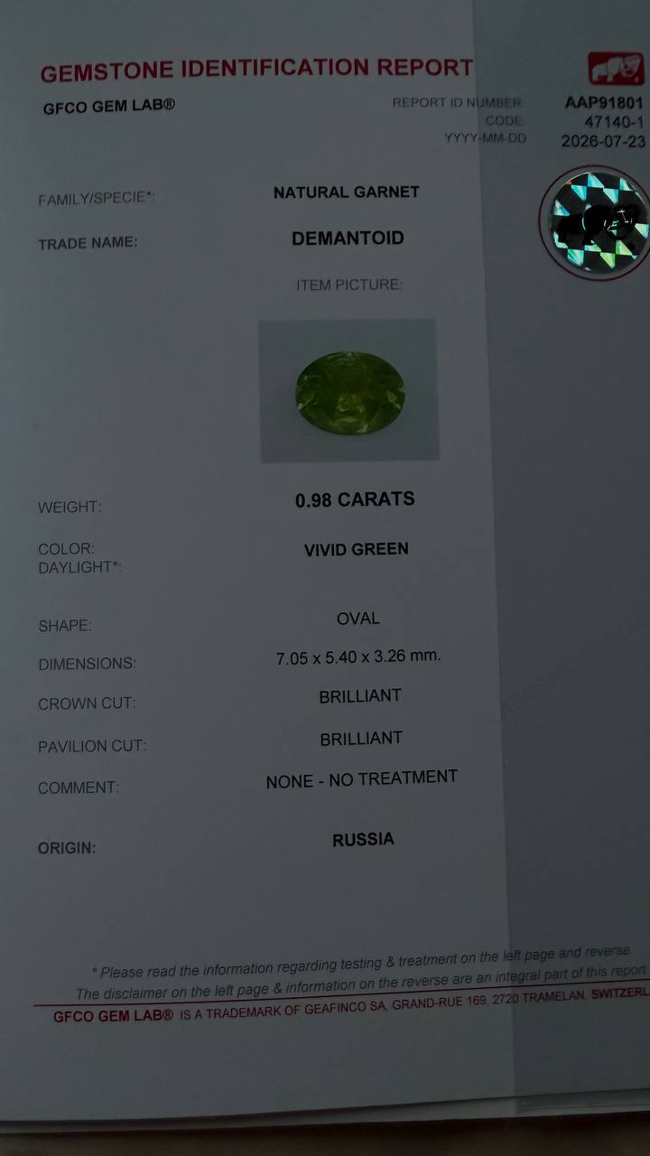 0.98 ct, Certified Russian faceted vivid apple green oval demantoid garnet with byssolite inclusions