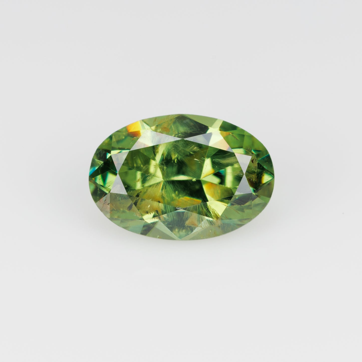 1.05 ct, Certified Russian faceted vivid green oval demantoid garnet with byssolite inclusions
