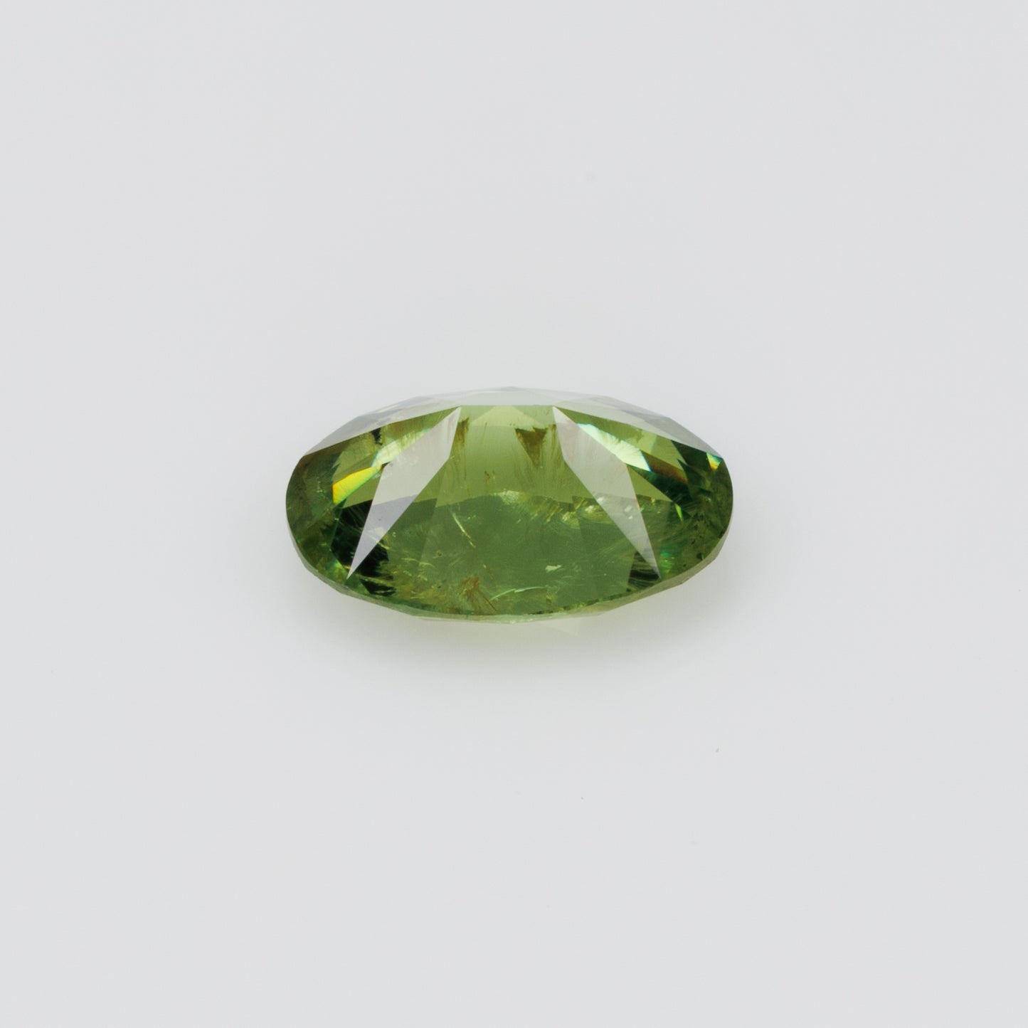 1.05 ct, Certified Russian faceted vivid green oval demantoid garnet with byssolite inclusions