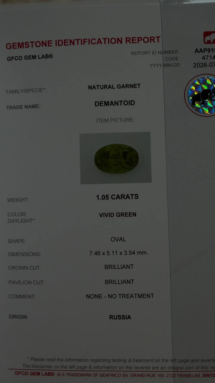 1.05 ct, Certified Russian faceted vivid green oval demantoid garnet with byssolite inclusions