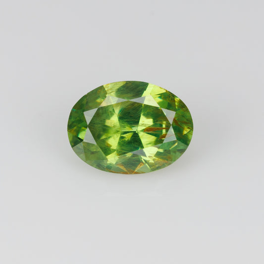0.41 ct, Certified Russian faceted vivid green oval demantoid garnet with byssolite inclusions