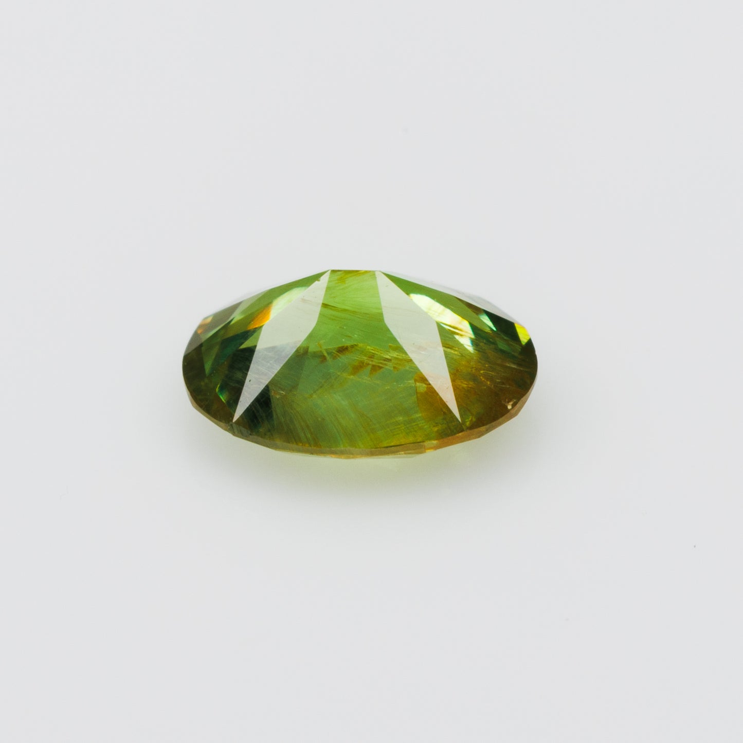 0.41 ct, Certified Russian faceted vivid green oval demantoid garnet with byssolite inclusions