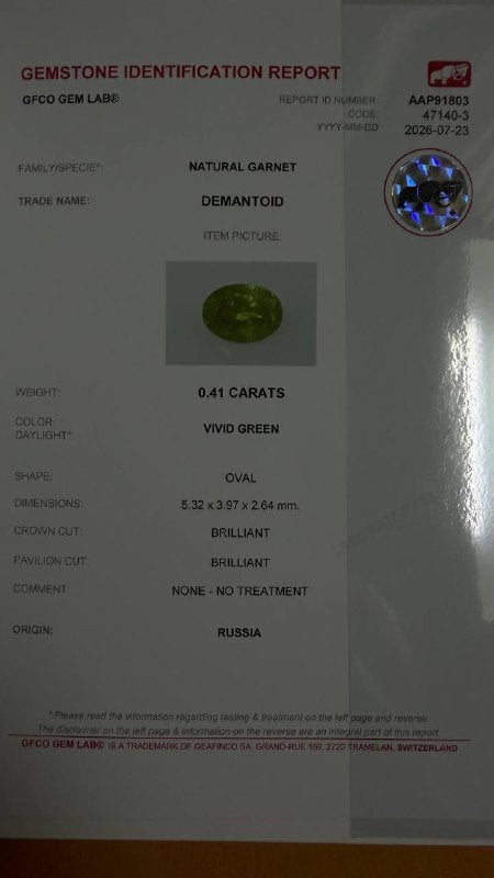 0.41 ct, Certified Russian faceted vivid green oval demantoid garnet with byssolite inclusions