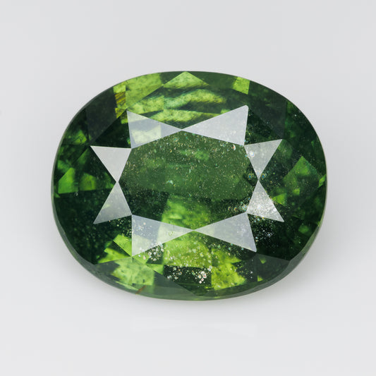 8 cts, Faceted vivid green zircon with amazing glow of the inclusions
