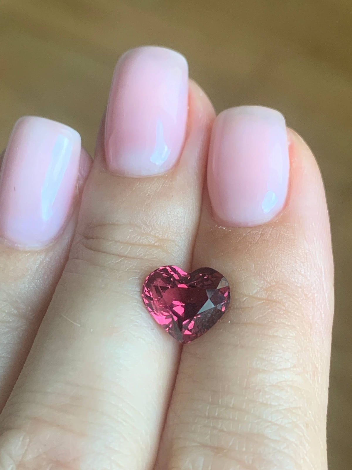 3.6 cts, Faceted Malaya heart shape garnet