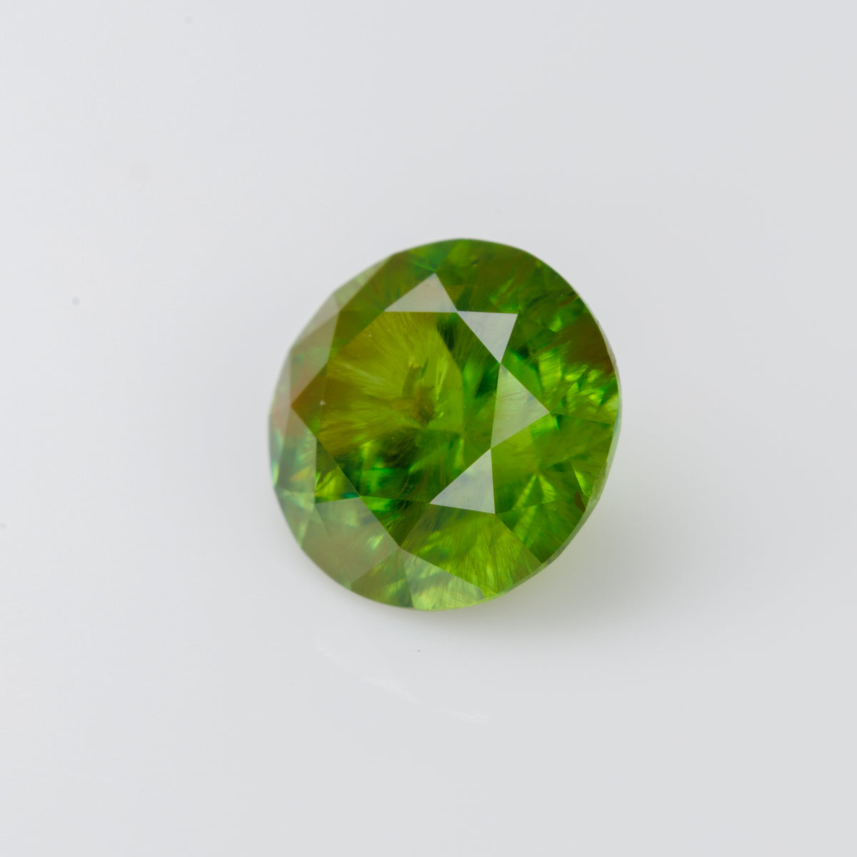 1.15 CTs, Faceted Russian demantoid garnet with horsetail inclusion