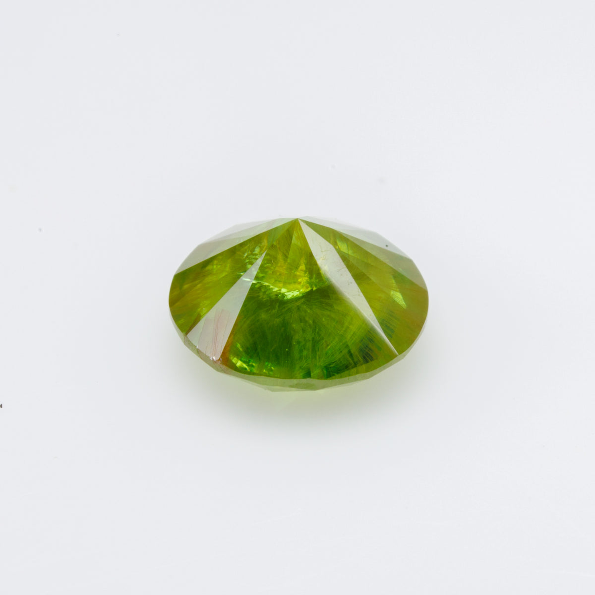 1.15 CTs, Faceted Russian demantoid garnet with horsetail inclusion