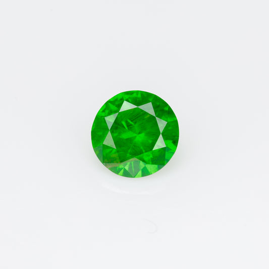 0.55 ct, Faceted Russian demantoid garnet with horsetail inclusion