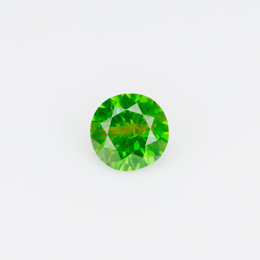 0.47 ct, Faceted Russian demantoid garnet with byssolite inclusion