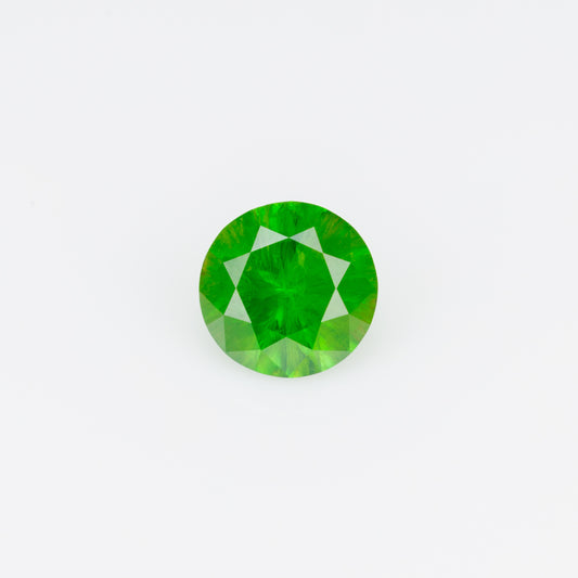0.48 ct, Faceted Russian demantoid garnet with horsetail inclusion