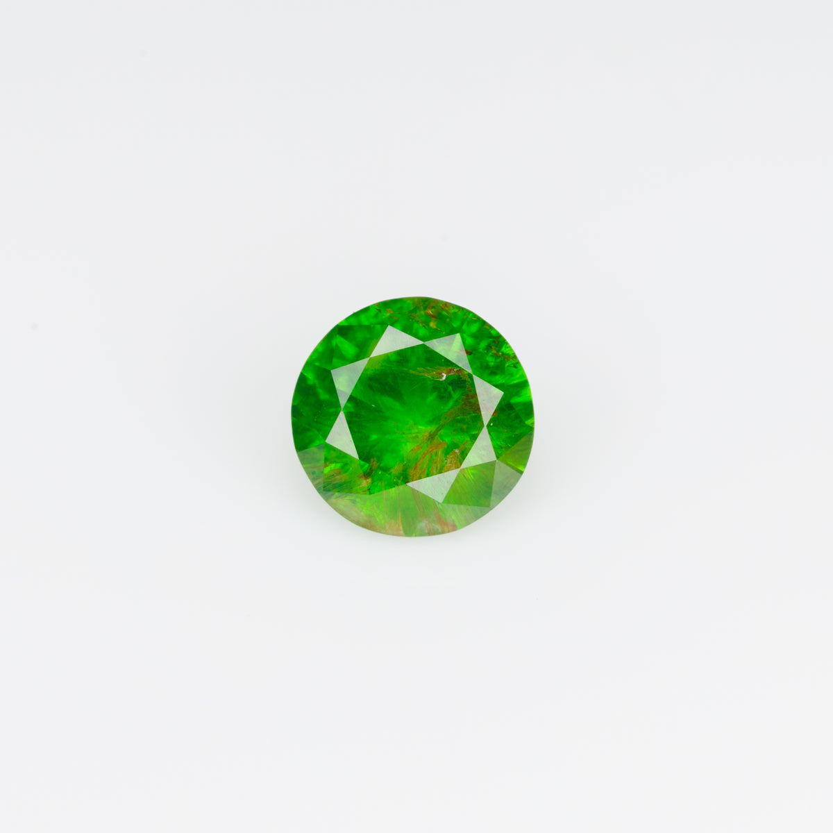0.38 ct, Faceted Russian demantoid garnet with byssolite  inclusions
