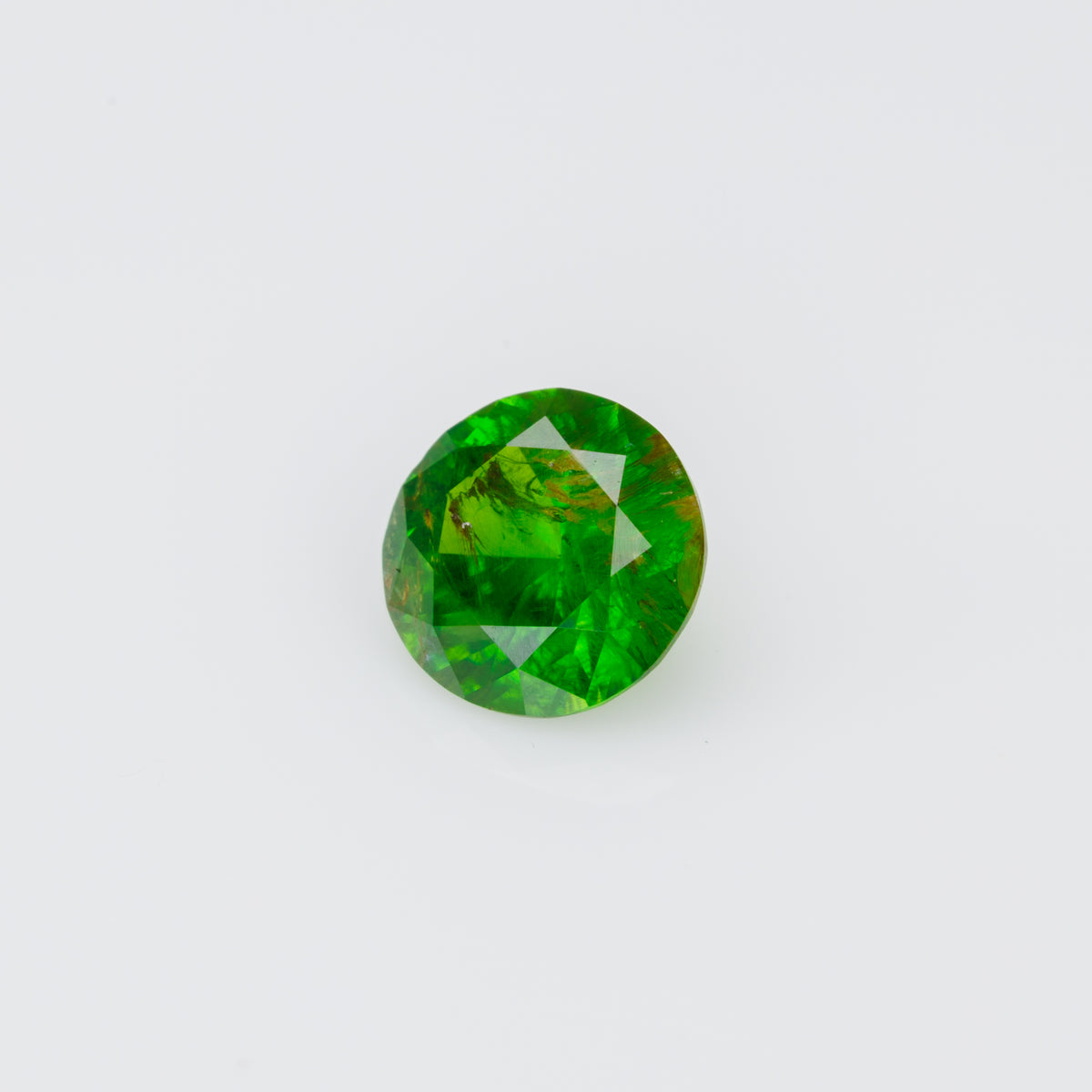 0.38 ct, Faceted Russian demantoid garnet with byssolite  inclusions