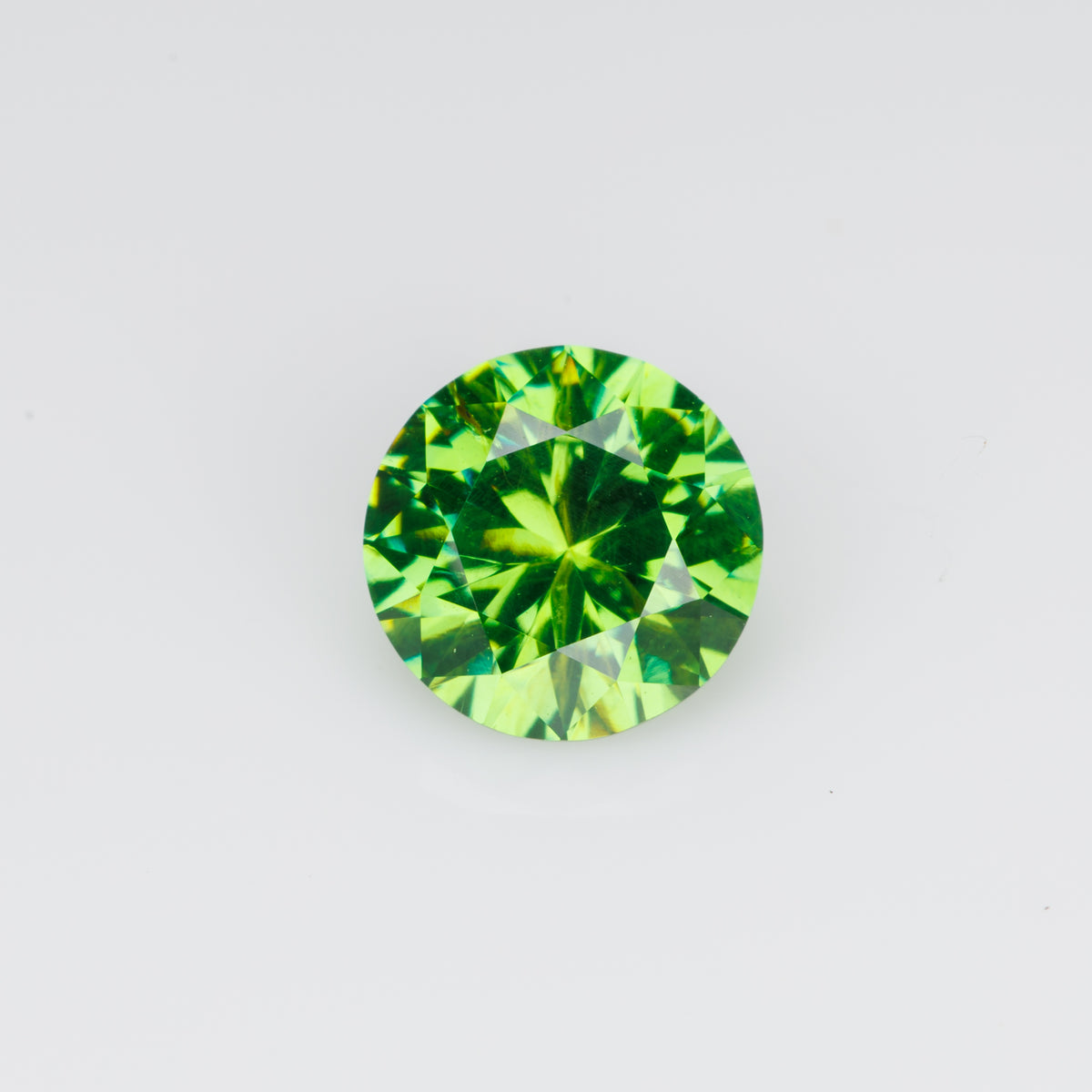 0.76 ct, Faceted Russian demantoid garnet with high dispersion