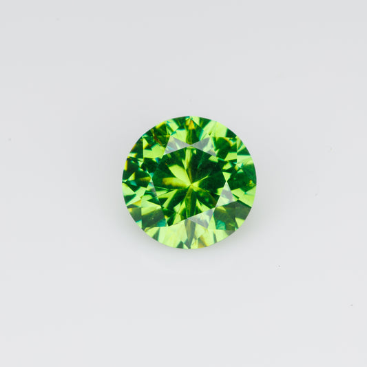 0.76 ct, Faceted Russian demantoid garnet with high dispersion