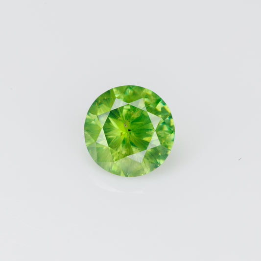 0.56 ct, Faceted Russian demantoid garnet with byssolite inclusions