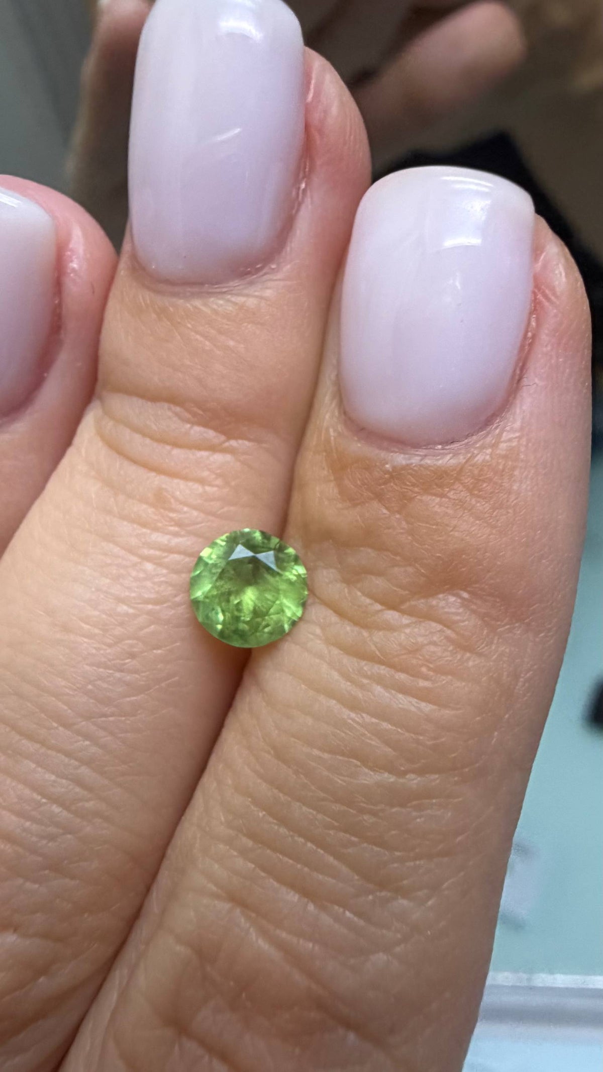 0.99 ct, Vivid yellowish grene faceted Russian demantoid garnet