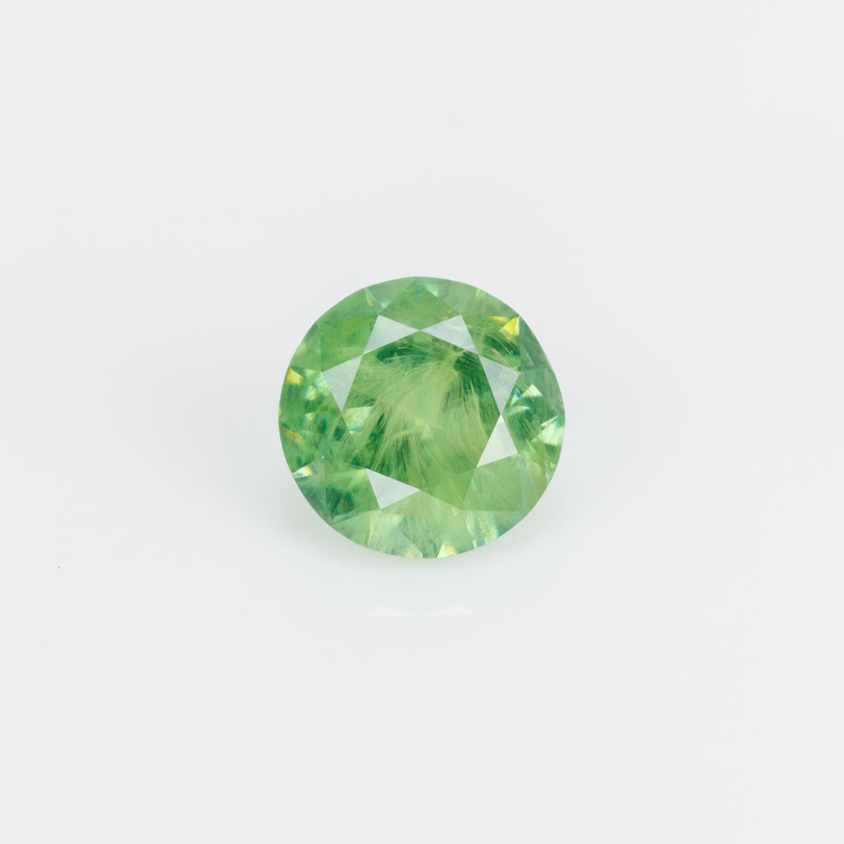 0.99 ct, Vivid yellowish grene faceted Russian demantoid garnet