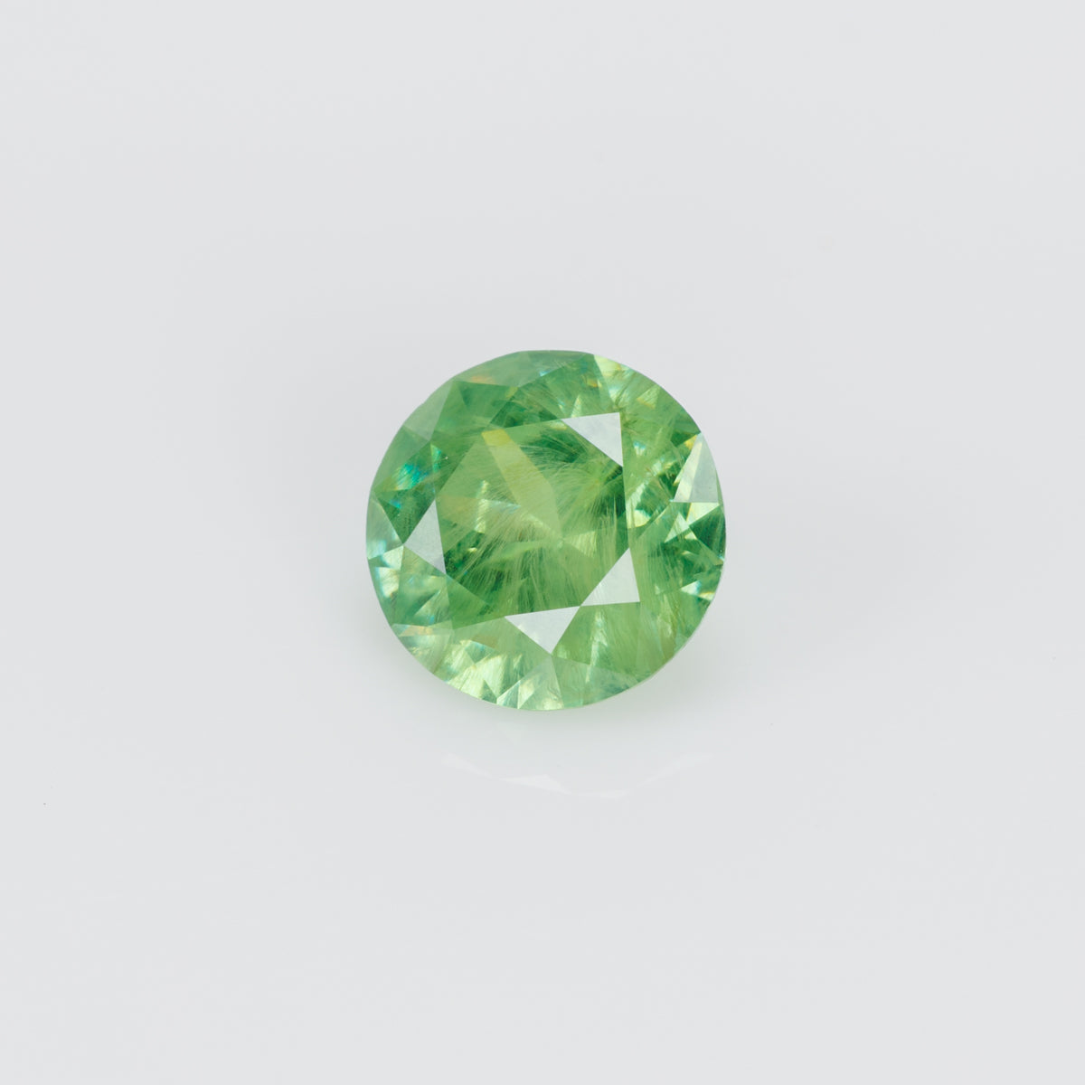 0.99 ct, Vivid yellowish grene faceted Russian demantoid garnet