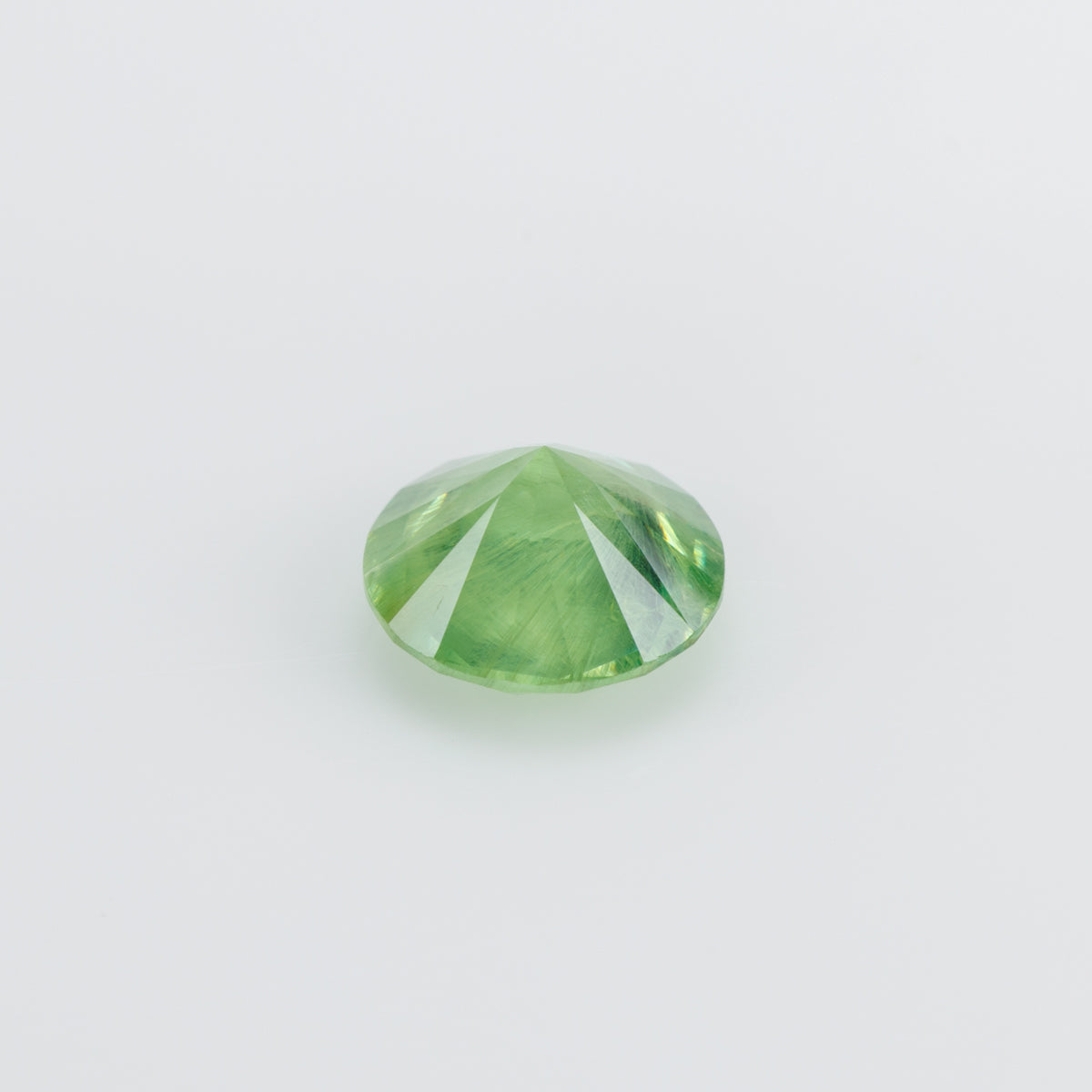 0.99 ct, Vivid yellowish grene faceted Russian demantoid garnet