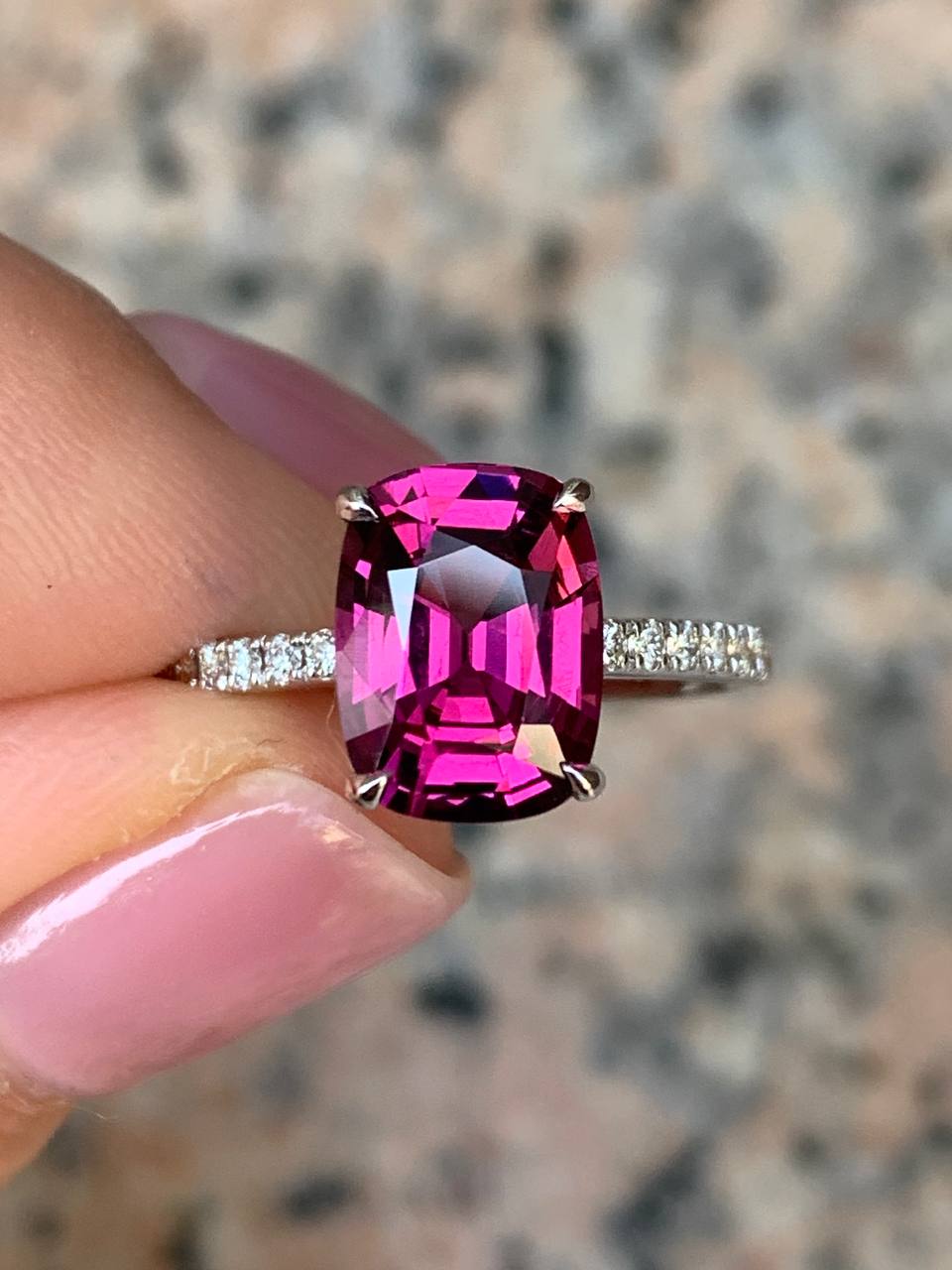 Golden ring with faceted rhodolite garnet