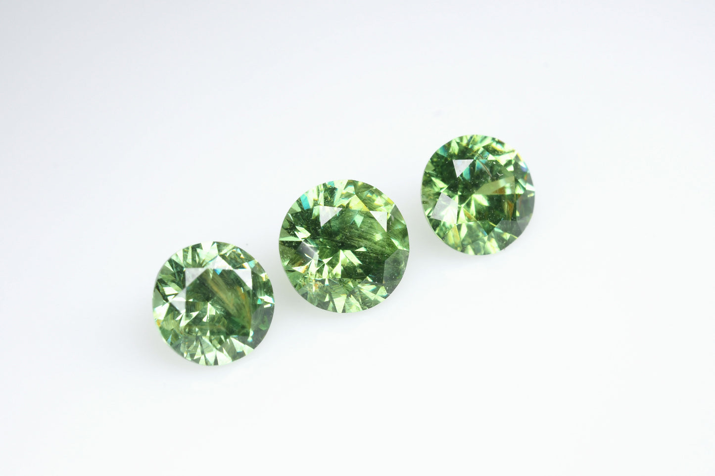 Russian demantoid set, faceted demantoid garnet set 1,64 ct