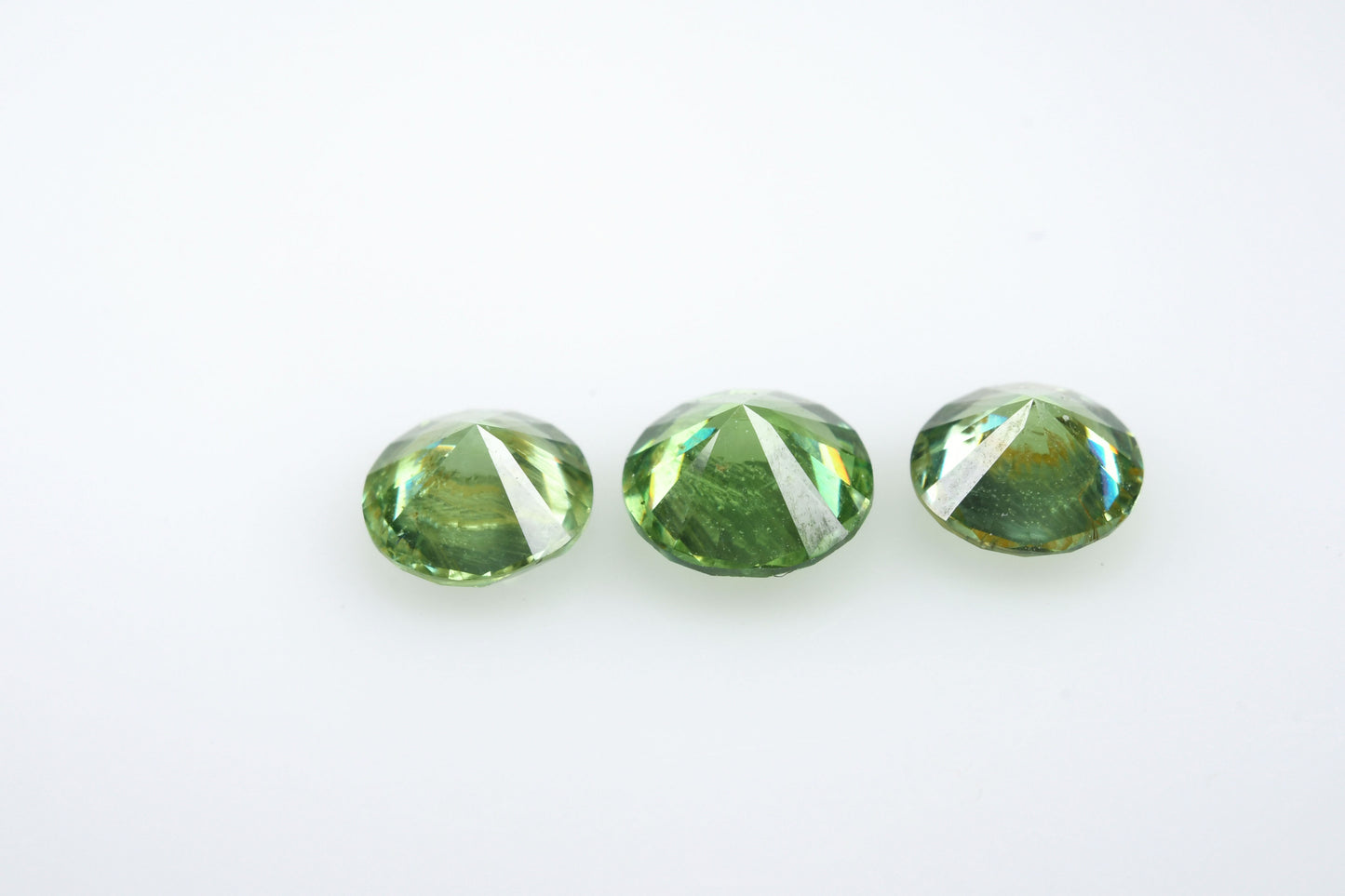 Russian demantoid set, faceted demantoid garnet set 1,64 ct