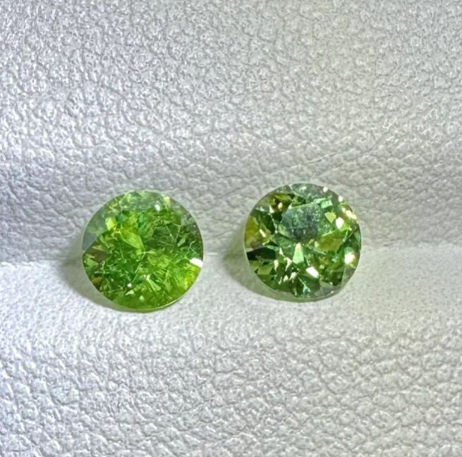 Faceted demantoid pair 0.75 ct