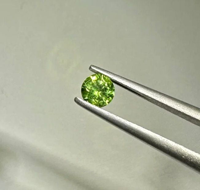 Faceted demantoid garnet