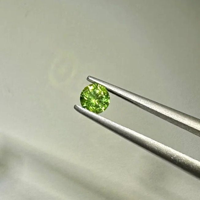 Faceted demantoid garnet