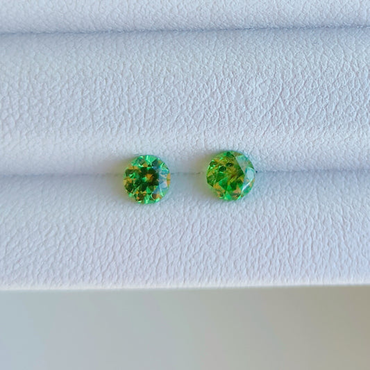 Faceted pair demantoid garnet 0.13 ct