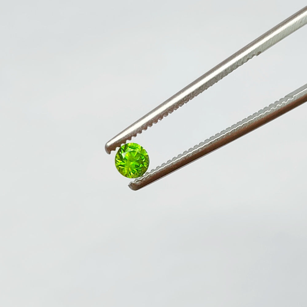 Faceted demantoid garnet set